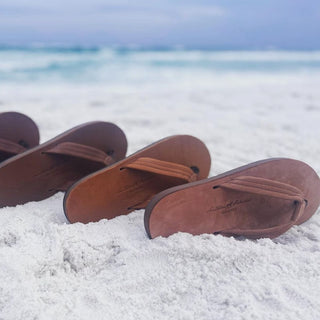 Southern Polished sandals in the sand at the beach