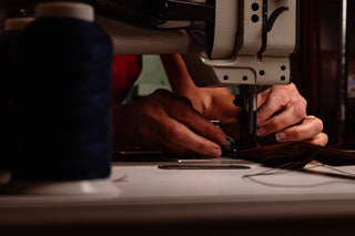 Craftsman working on Southern Polished Sandals