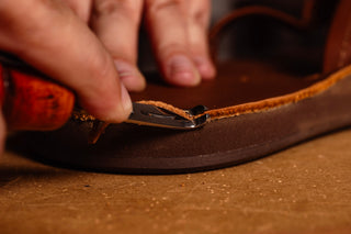 Craftsman working on Southern Polished Sandals